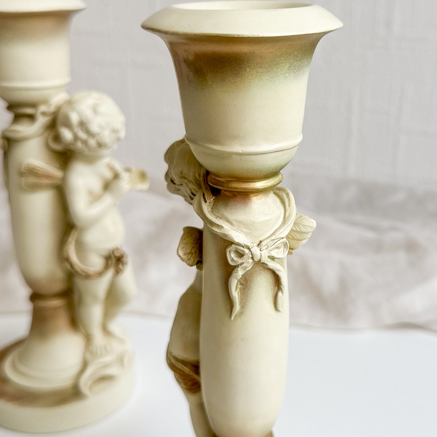 Pair of Cherub Candlesticks