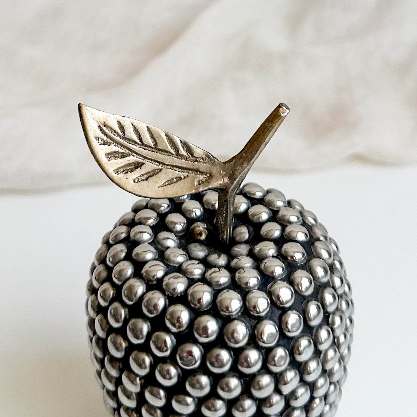 Studded Apple with Brass Leaf