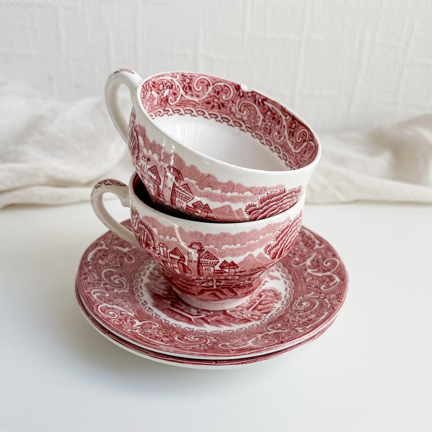 Pair of Red Transferware Tea Cups and Saucers